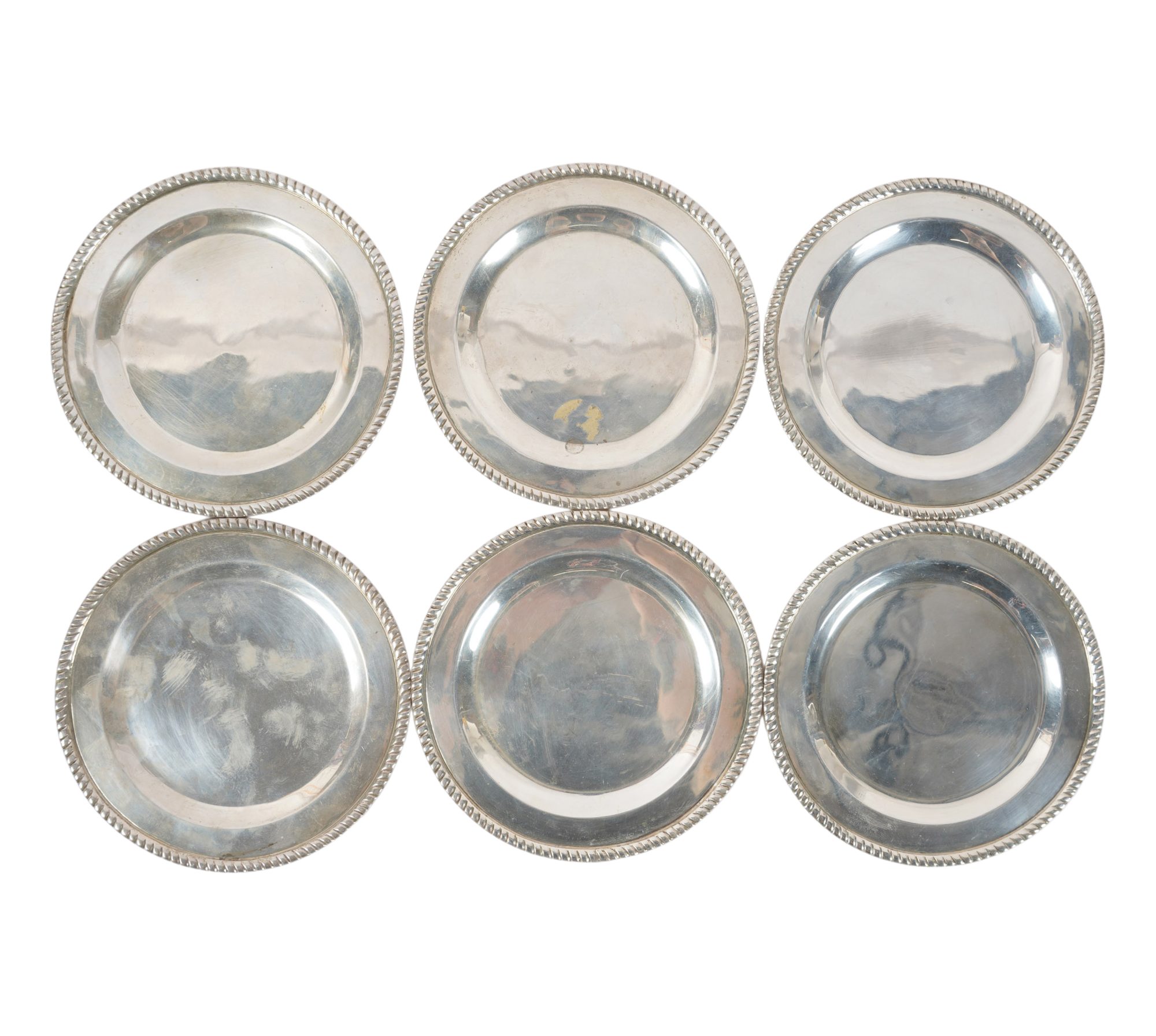 A Set of Six Mexican Sterling Silver Bread Plates