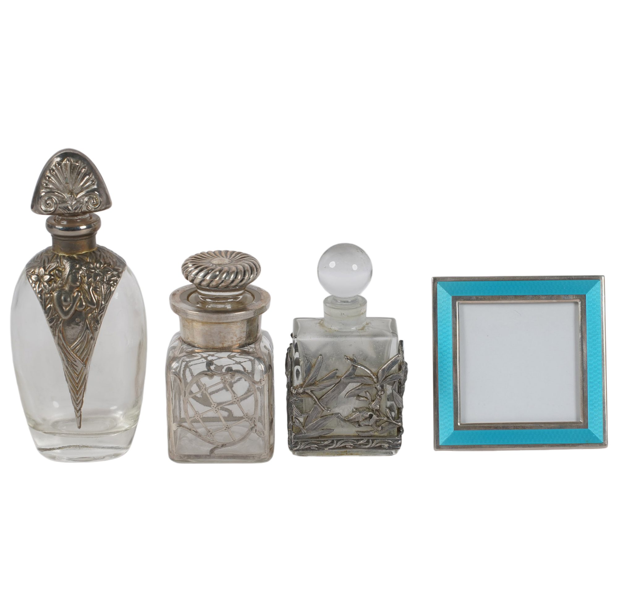 Three Sterling, Silver plate, and Glass Vanity Bottles, with Tiffany Picture Frame.