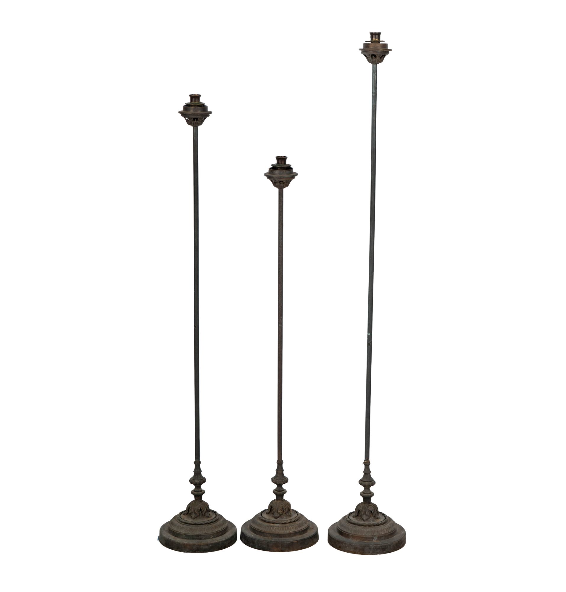 Three Tall Bronze Candlesticks