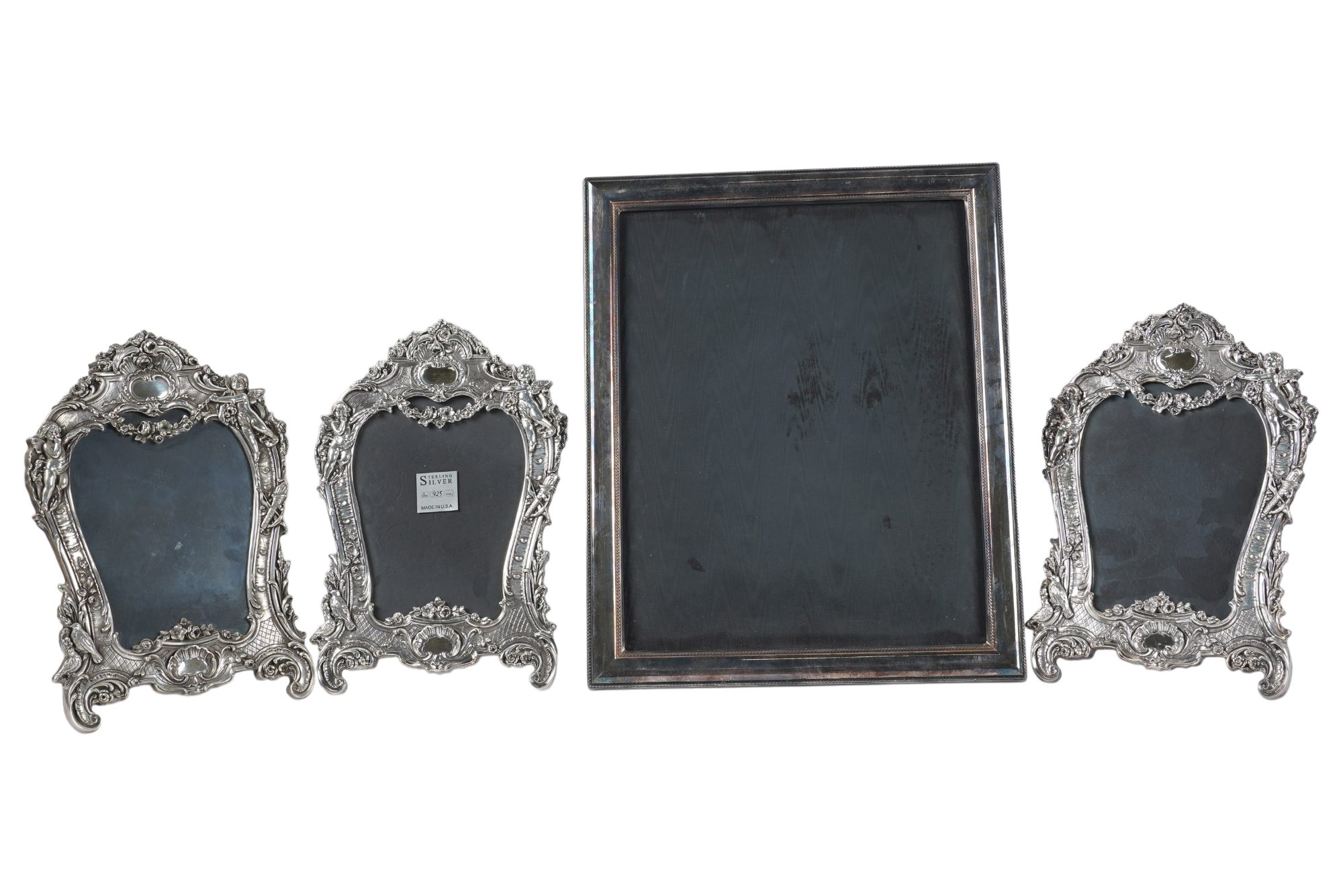 Four Sterling Picture Frames