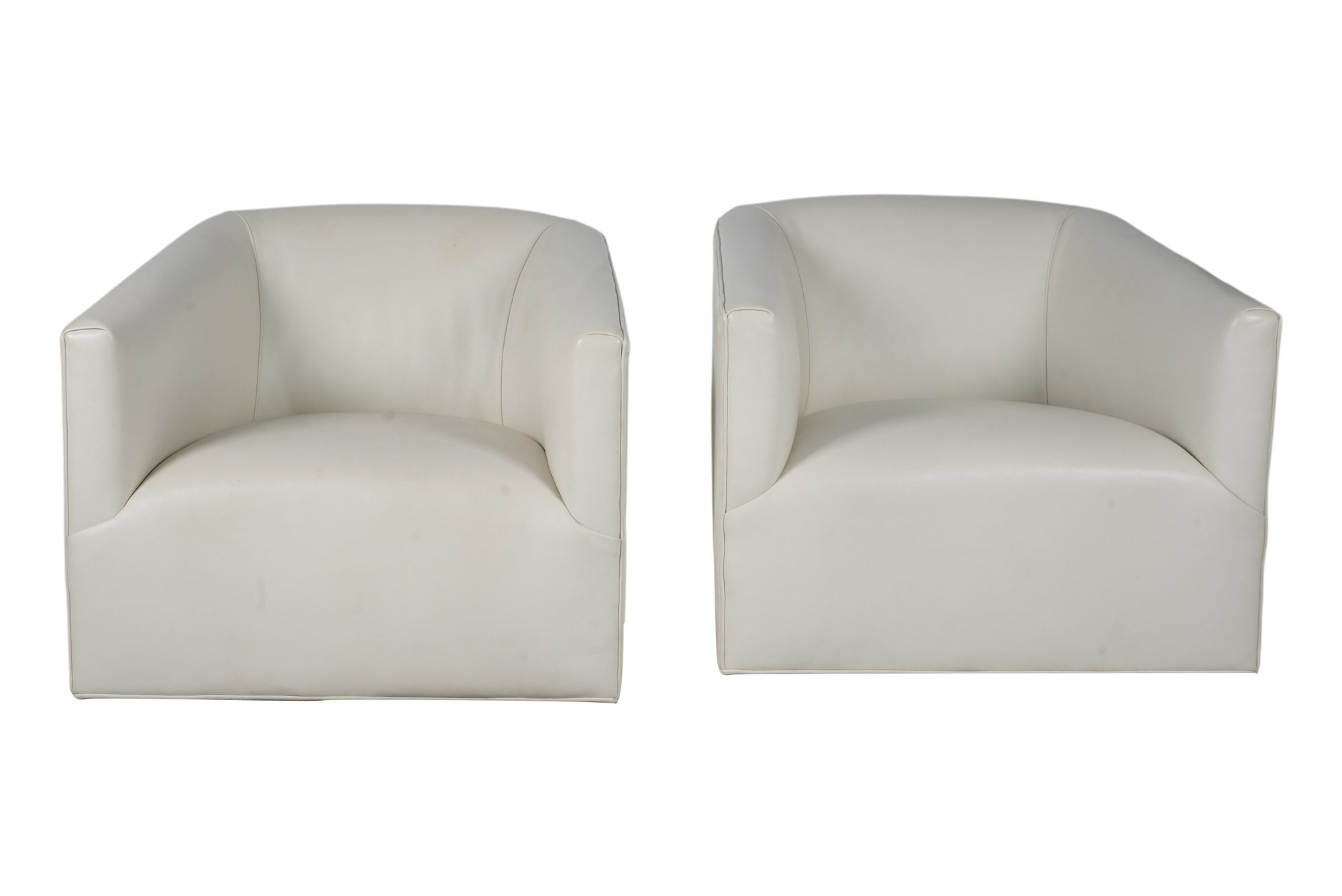 A Pair of White Leather Upholstered Swivel Club Chairs
