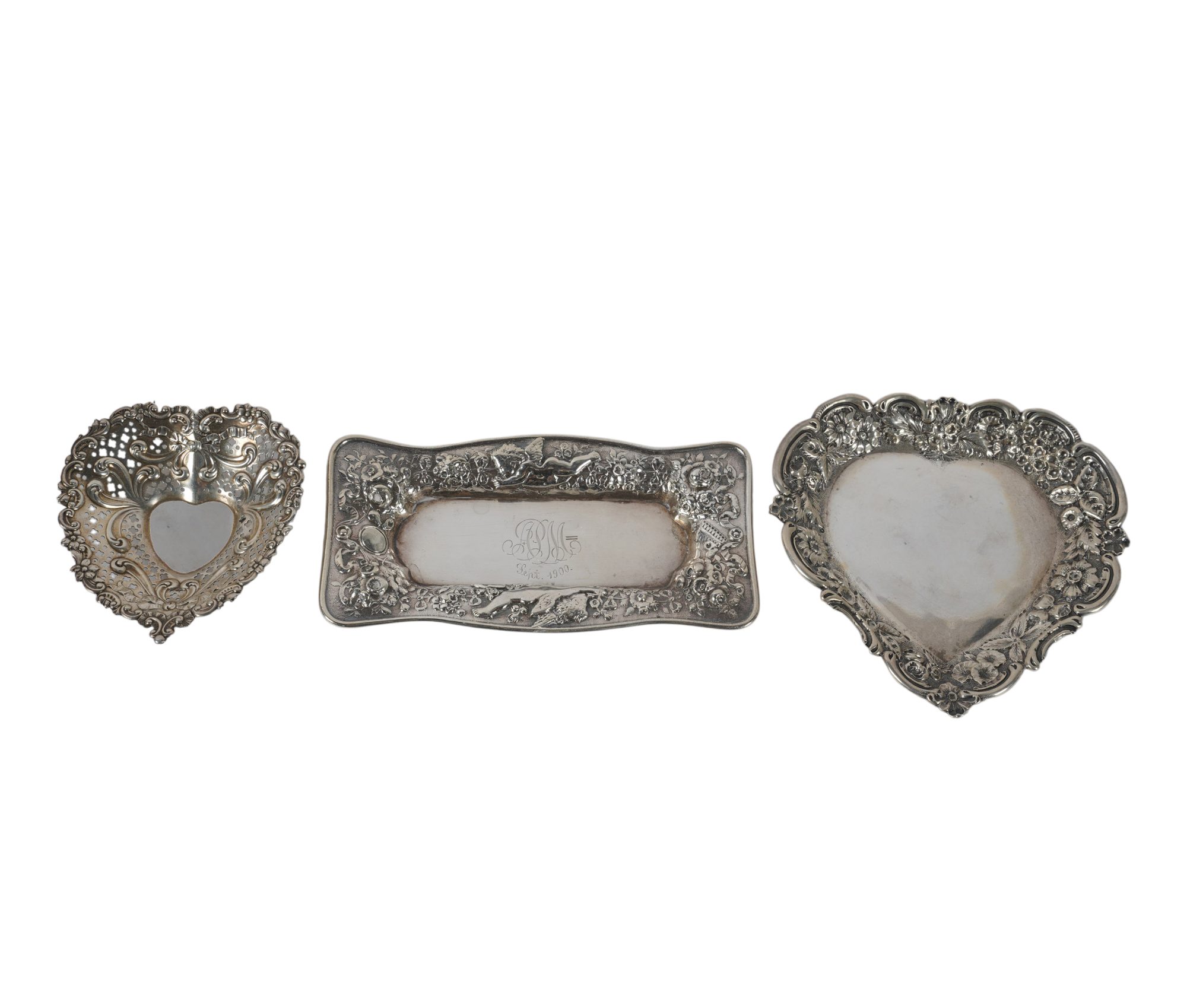 A Collection of Sterling Silver Repousse Trays
