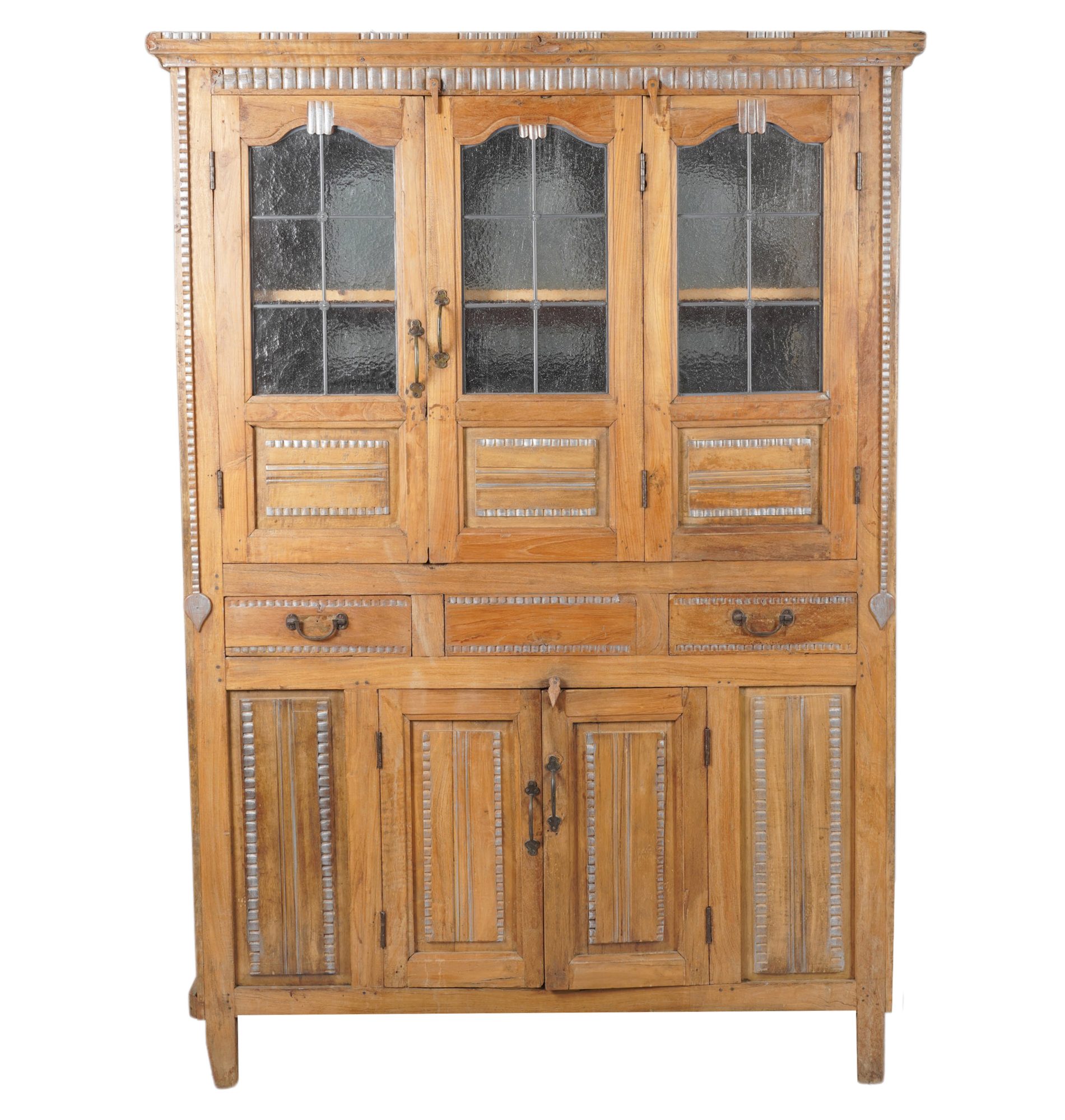 A Continental Hardwood Cupboard with Silver Gilt Carvings