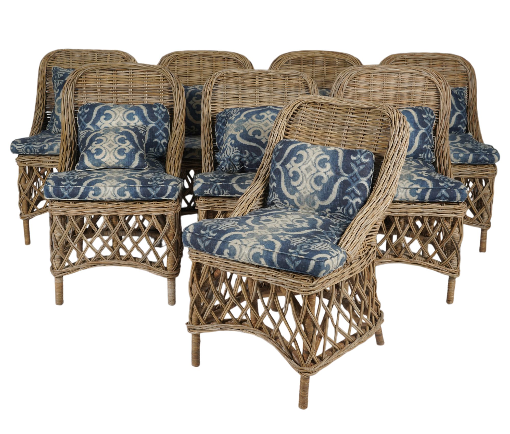 A Set of Eight Wicker Works Style Dining Chairs